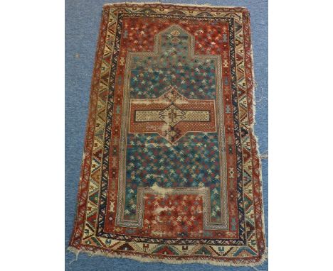 A hand knotted Eastern Prayer Rug, the turquoise blue point with two small lozenge shapes and further surrounded by light blu