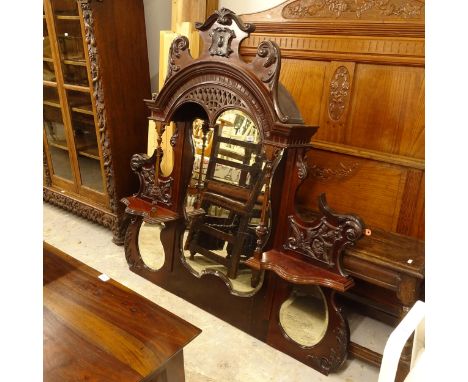 An ornate late Victorian mahogany over-mantel mirror, W130cm, H138cm 