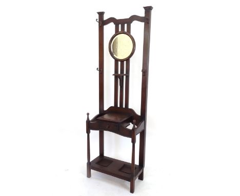An Edwardian mahogany mirror-back hallstand (some beading missing), W60cm, H194cm, D30cm 