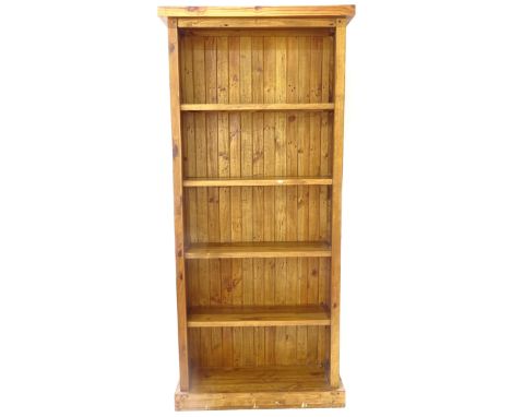 A large modern pine open bookcase, with 5 fixed shelves, W96cm, H212cm, D34cm, shelf depth 26cm (WITH THE OPTION TO PURCHASE 