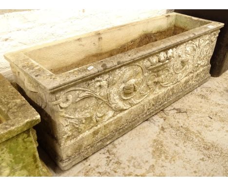 A rectangular weathered and embossed concrete garden trough, L117cm, H40cm, D38cm 