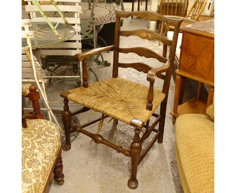 A 19th century country Chippendale ladder-back armchair with rush seatGood overall condition, joints seem stable, there are s