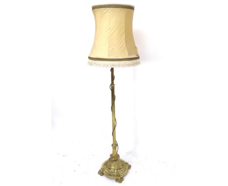 An Antique brass Corinthian column standard lamp and shade 