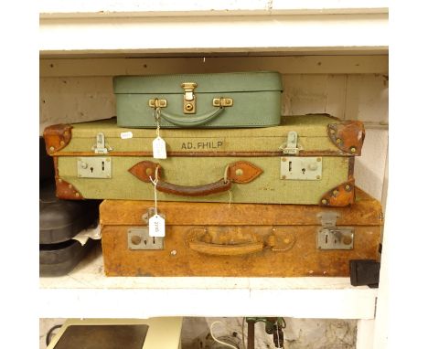 A Vintage leather suitcase, a Vintage canvas and leather-bound suitcase and another (3) 