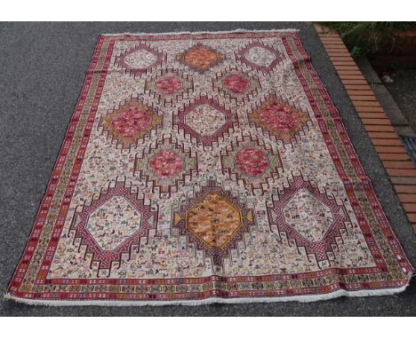 A cream ground Afghan design carpet, with 3 symmetrical borders and animal decorated guls, 282cm x 204cmGood overall conditio