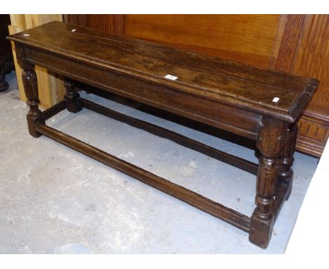 An Antique oak jointed bench on carved legs, L120cm, H50cm, D27cm 