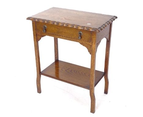 A rectangular oak side table, with single frieze drawer and shelf below, W61cm, H73cm, D38cm 