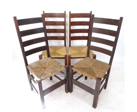A set of 4 Heals Letchworth Arts and Crafts ladder-back dining chairs, with rush seats, circa 1915 