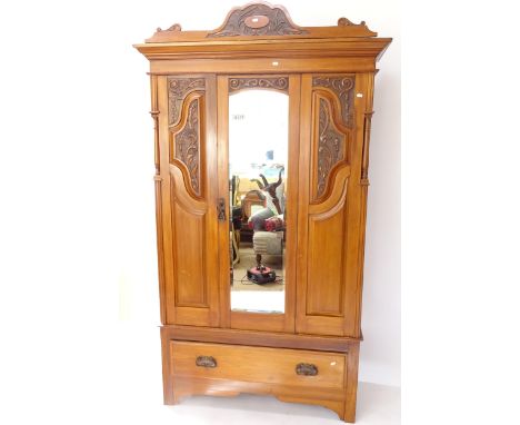 An Edwardian satin-walnut mirror-door wardrobe, with drawer to the base, W125cm 