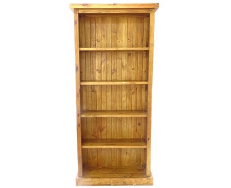 A large modern pine open bookcase, with 5 fixed shelves, W96cm, H212cm, D34cm, shelf depth 26cm 