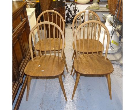 A set of 4 Ercol elm-seated stick-back kitchen chairs 