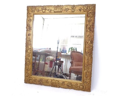 A carved gilt-framed wall mirror, W80cm, H93cm 
