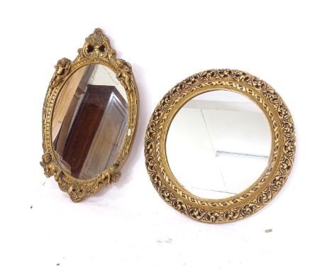 A gilt-gesso framed circular wall mirror, and an oval gilt-gesso wall mirror, with cherub decoration (2) 