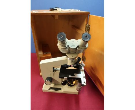 Wooden cased Russian Lomo binocular microscope in fitted case with key, with light source and all accessories 