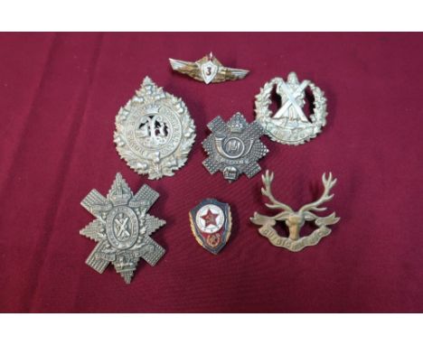 Small selection of Scottish cap badges including Highland Light Infantry and two Soviet Union enamel cap badges 