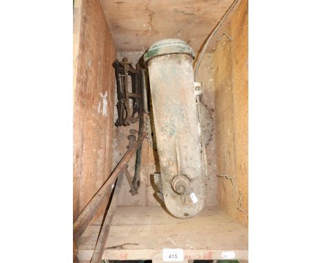 Early vintage cast metal clay pigeon trap with a large selection of clays with wooden storage crate and tripod stand 