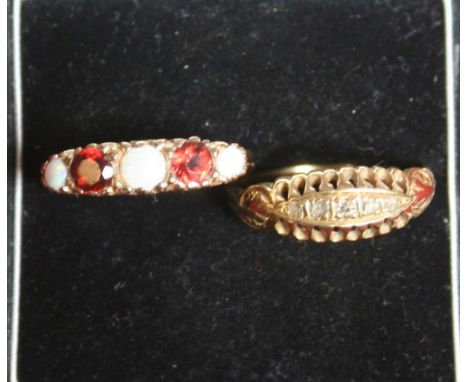 An Edwardian 18ct gold and diamond boat shaped ring, and a 9ct garnet and opal ring (2)