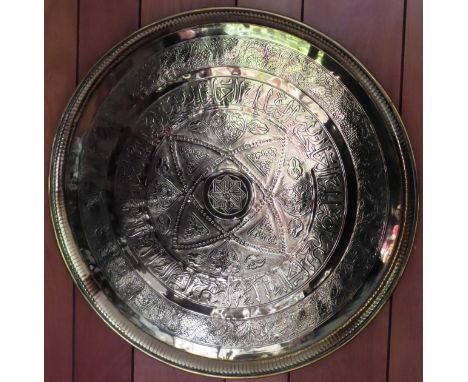 Large vintage Indian style brass circular plaque. Approx. 58cms diameter

reasonable used condition 