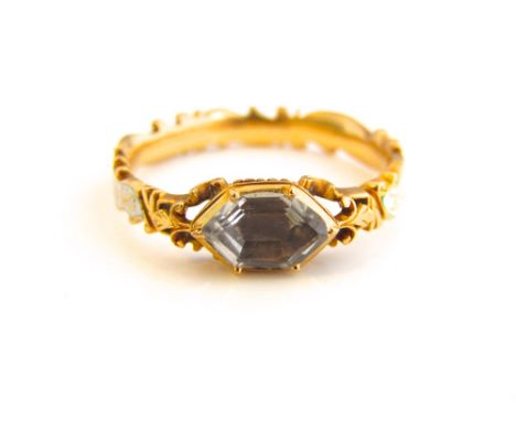 A George II unmarked yellow metal and enamel memorial ring, set with central free cut aquamarine, white enamal shoulders, ins