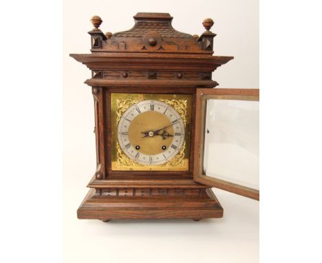 German oak bracket clock, with stepped architectural case, fitted with a two train 17cm brass dial, the movement inscribed 'D