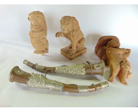 Three good wooden carvings, two of lions, the other a wall bracket in the form of a cherub together with six boxes containing