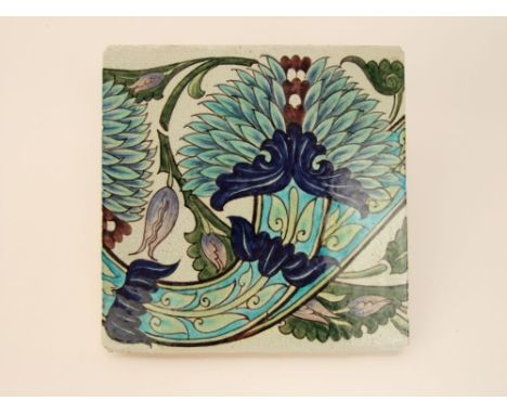 A William De Morgan tile with stylised leaf decoration in tones of turquoise, blue, green and mauve, with impressed mark to r