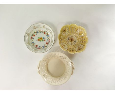 A Zsolnay Pecs bowl of shaped outline with pierced detail and painted and gilded floral sprays, printed and impressed numbers