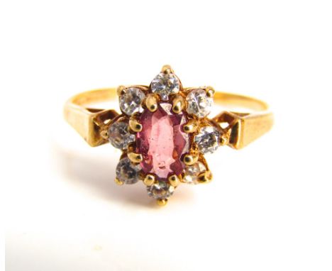 A 9k gold ruby and paste set flower ring, 1.5 g, ring size 'I'