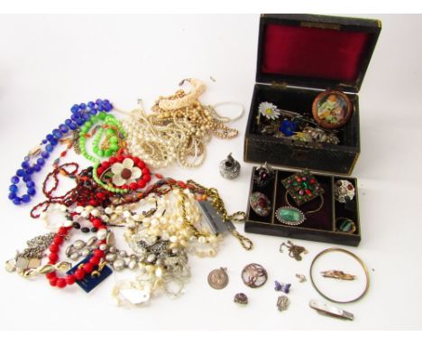 A collection of costume jewellery to include five white metal Scottish brooches, a silver St Christopher, a mother of pearl h