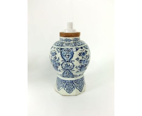 A large 18th century tin glazed earthenware vase (converted to a lamp) with blue and white painted floral and bird detail, 37