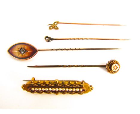 A small collection of 9k and yellow metal Etruscan style Victorian items to include a rose cut diamond stick pin, two further