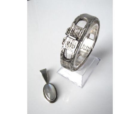 A sterling silver and moonstone pendant with Swedish import marks Birmingham 2012 together with a heavy gauge silver bangle w