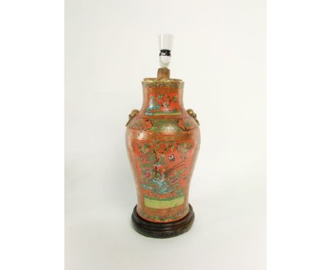 A good quality 19th century oriental vase with polychrome painted bird and floral decoration on a brick red ground with mould