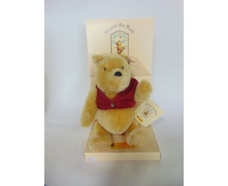 A Boxed limited edition Steiff mohair Winnie The Pooh together with a limited edition Dean's stuffed Piglet with certificate 