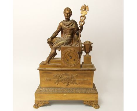 Good French Ormolu two train figural mantle clock, mounted with a seated Romanic soldier next to a campania urn, fitted with 