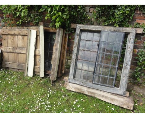 An early reclaimed oak framed window with leaded light and iron framed openings together with one other later example and a r