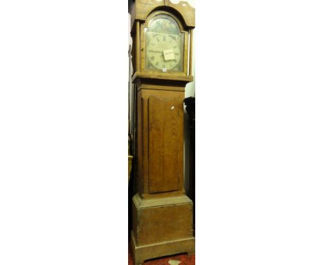 A 19th century stripped and waxed pine cottage longcase clock with painted broken arched dial, 30-hour movement, T Evans of N