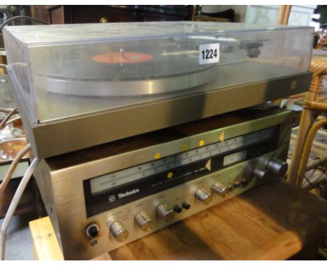 A Technics music system comprising FGServo record player model SL-20 FM/AM stereo receiver model SA-5250, a pair of associate
