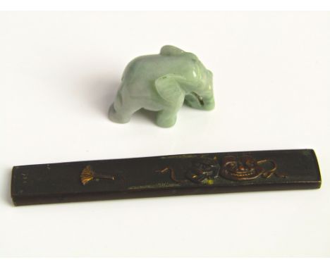 A Shakudo style Japanese paper knife sheath, together with a jade carving of an elephant