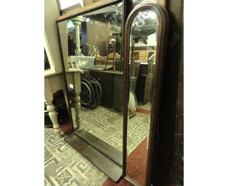 A pair of arched mirrors with bevelled edged plate, a large barber's mirror in rectangular frame incorporating a shelf and a 