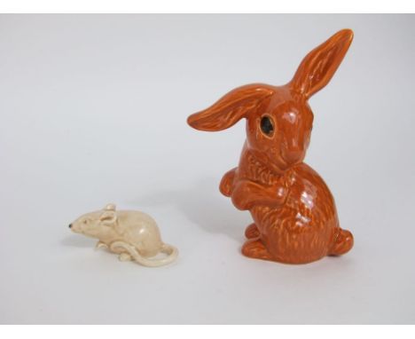 A Sylvac model of a rabbit in the burnt orange colourway with impressed numbers to base 1303, 18cm tall approx together with 