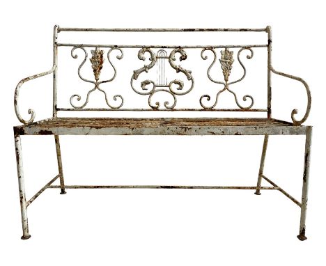 Regency design wrought metal garden bench, central lyre back with foliate S-scrolls with serpent masks, flanked by two floral