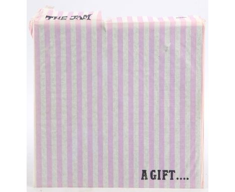 Vinyl record - The Jam ' The Gift' in original striped paper 'Gift bag' and inner sleeve (no outer sleeve) . Condition Report