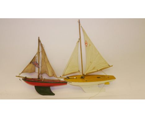 Vintage Pond Yachts and Dolls, Two painted wooden pond yachts, by Star Yachts, Birkenhead with sails, together with a collect