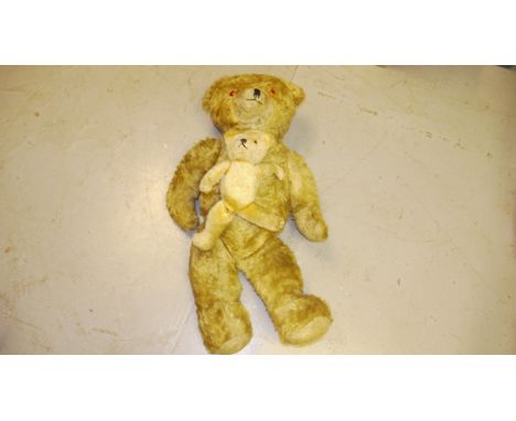 Vintage Teddy Bears, A large jointed golden mohair teddy bear by Lefray, with plastic eyes 35" tall together with a smaller s