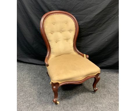 A Victorian mahogany button back nursing chair, upholstered in coffee brown, shaped fore legs, 89cm high 