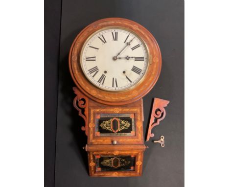 An American marquetry inlaid wall clock, cream dial, bold Roman numerals, shaped case with inset black and gilt glass panels,