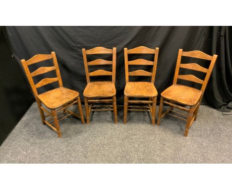 A set of four beech ladder back chapel chairs, shaped seats 