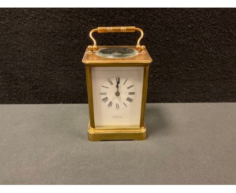 A French brass carriage clock, the white dial, signed W Bell, Lancaster,  with bold Roman numerals, spade hands, indistinctly