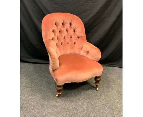 A button back library/nursing chair, serpentine seat, pink upholstery, turned fore legs, 92cm high 